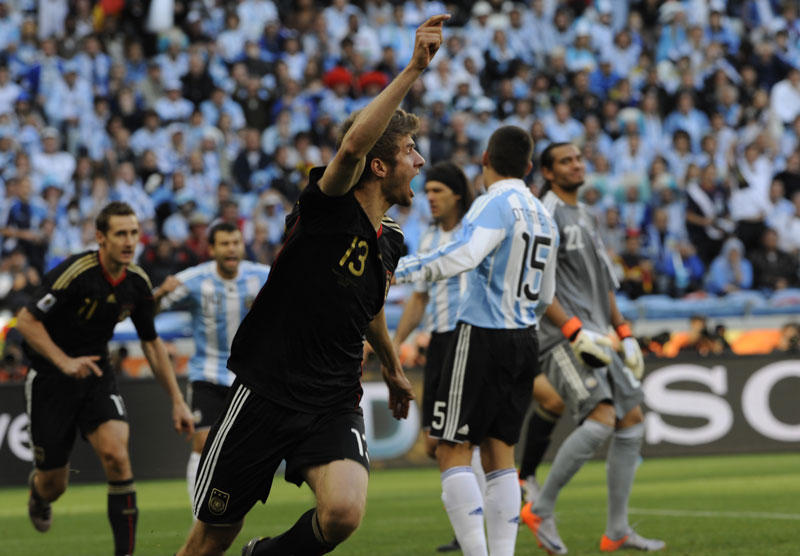 Thomas Mueller celebrates scoring Germany's opening goal against Argentina.